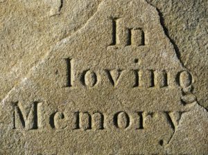 tombstone saying "in loving memory"